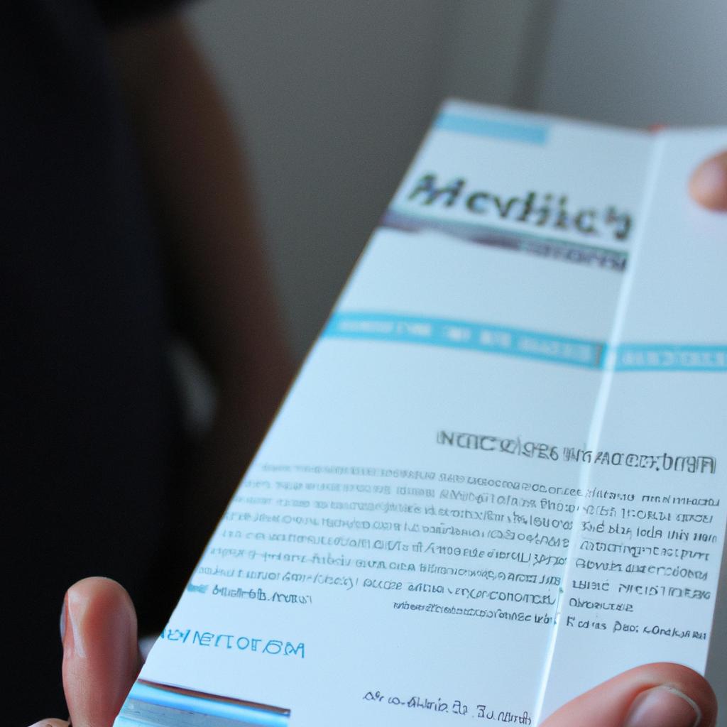 Person holding a medical brochure